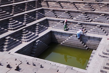 Travel Scientists adventure rally India's Cup Hindustan Ambassador race drive Amby in India women washing in well by hand